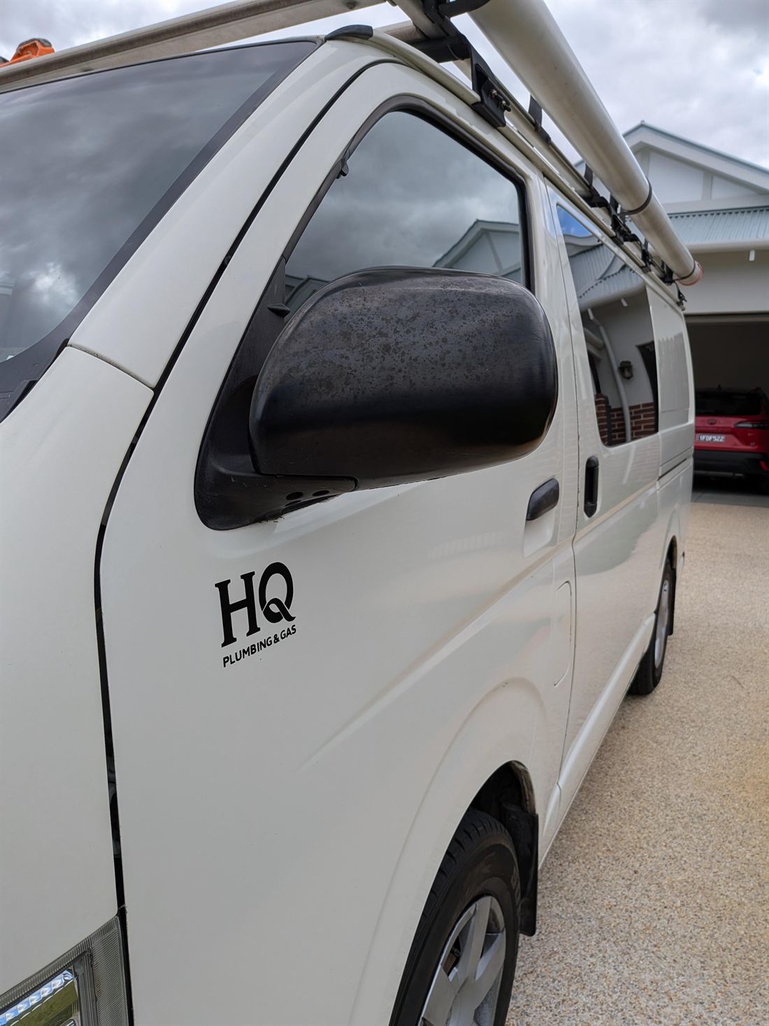 The HQ Plumbing & Gas van parked in the driveway of a Perth home